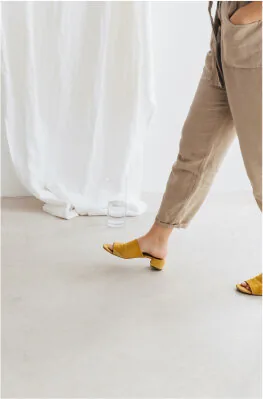 Gentle detail of bare feet on soft fabric