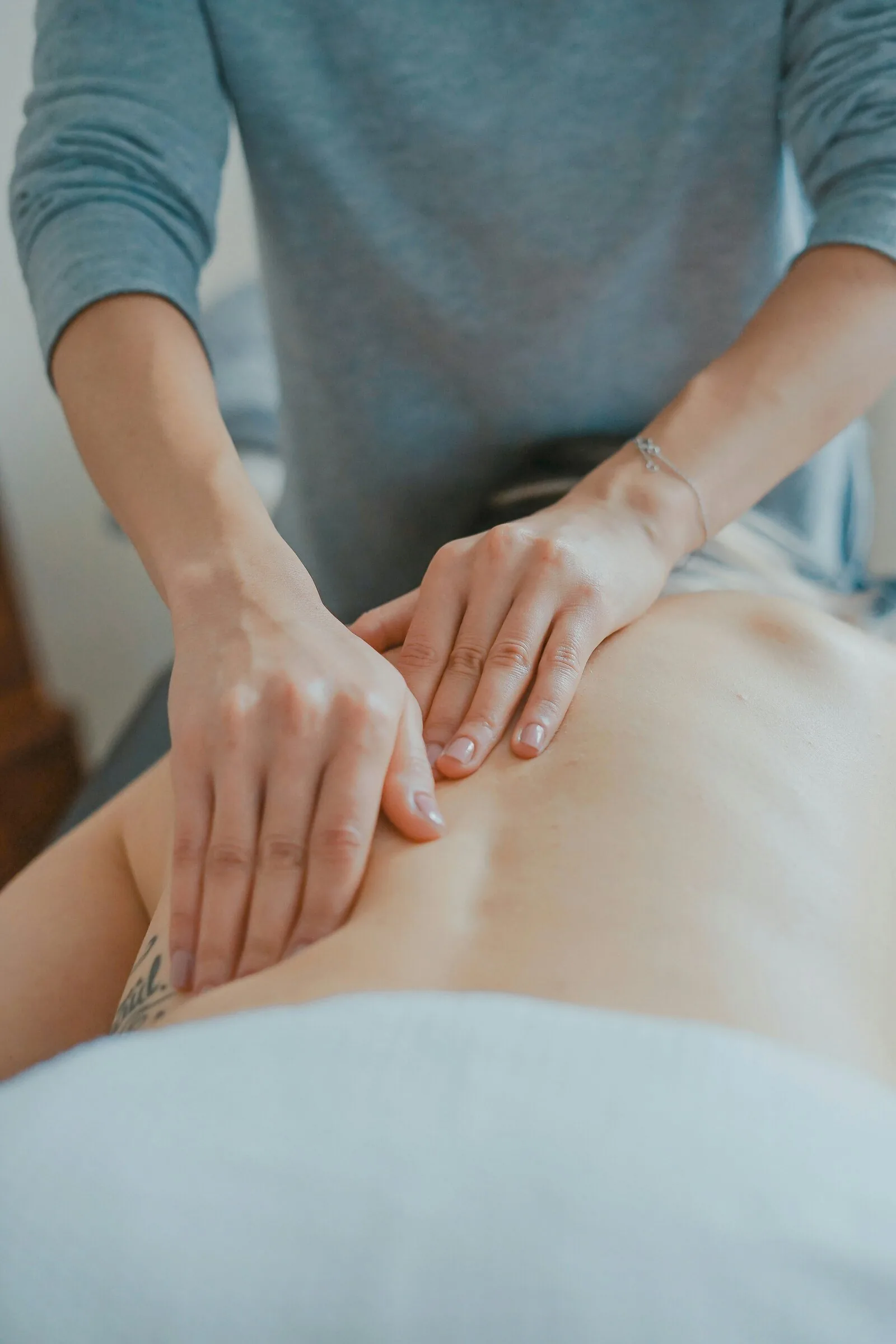 Practitioner giving a hands-on osteopathic treatment