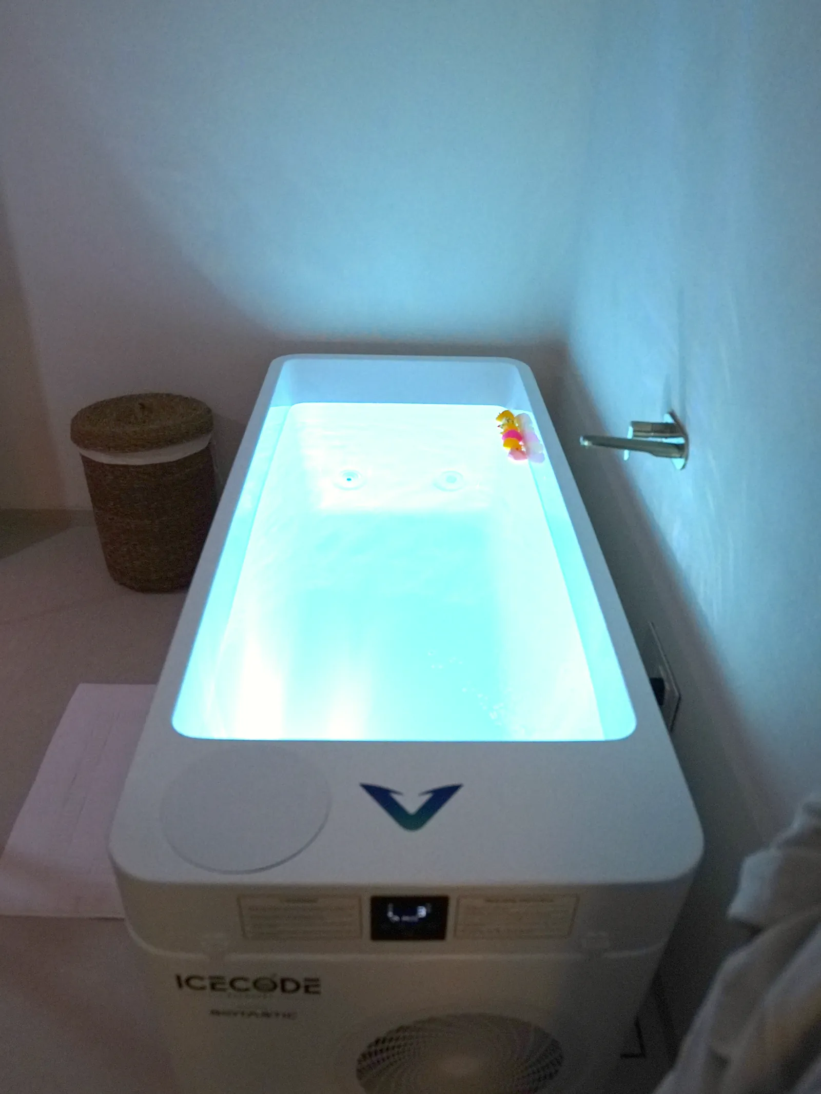 The glowing cold plunge tub in its treatment room