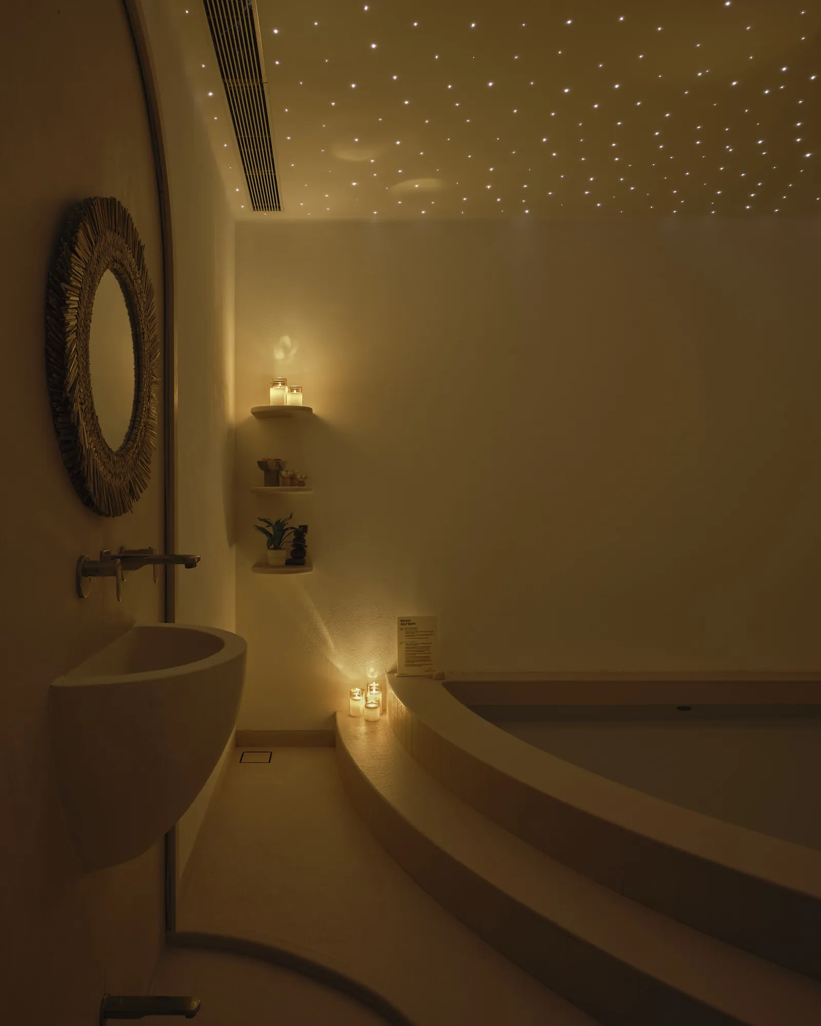 The candlelit salt bath room beneath its starlit ceiling